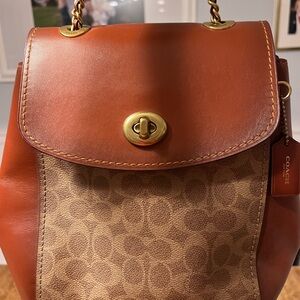 Coach backpack with matching wallet. Used a few times. One mark as seen in photo
